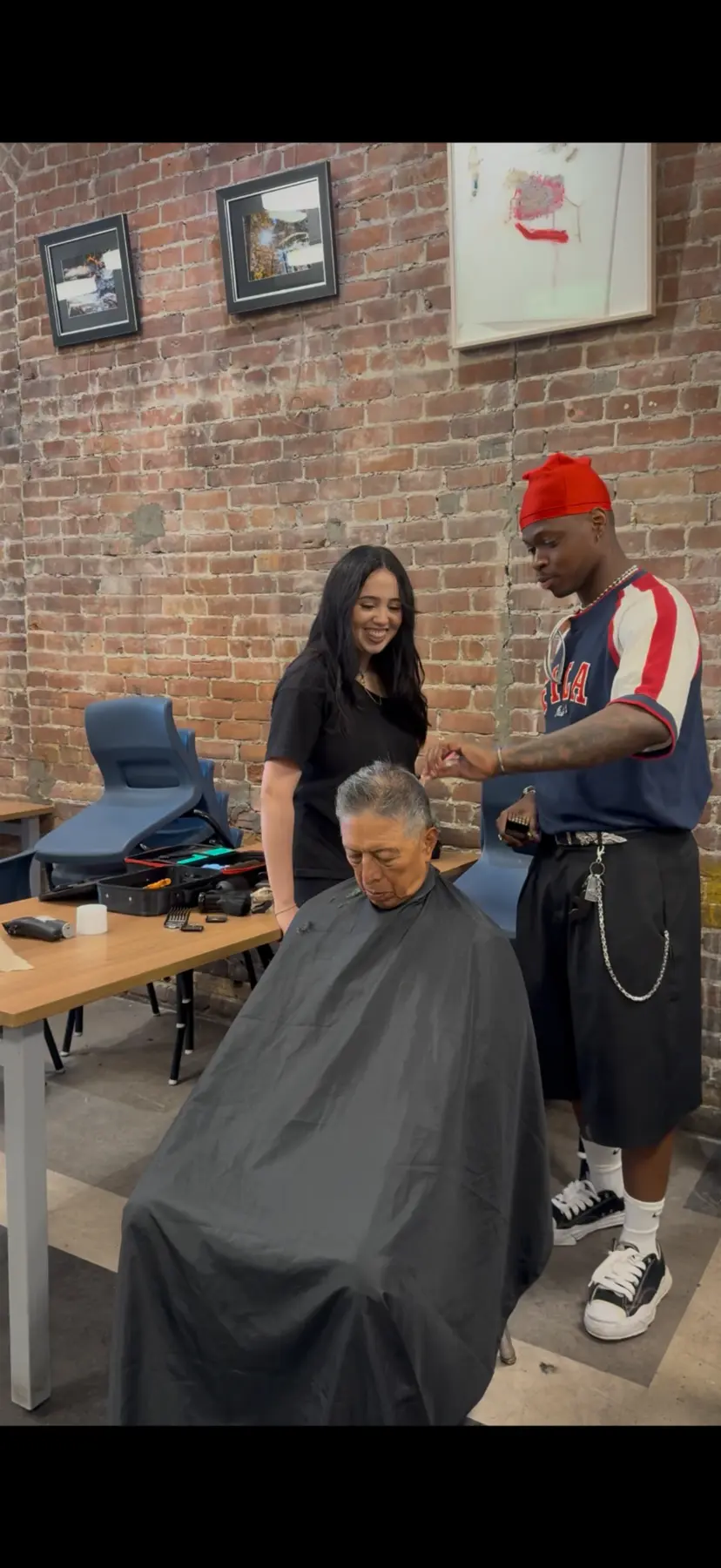 Jason Luce guiding a live-model barbering session at CK Academy