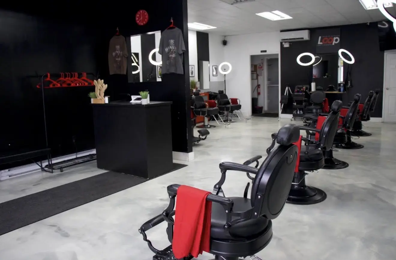 Barber chairs and workstations inside Loop Barbershop
